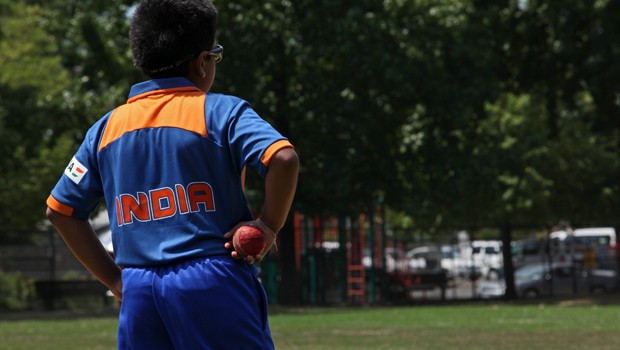 One of the younger cricket players retrieves a ball at Walker's Park on a recent Saturday.